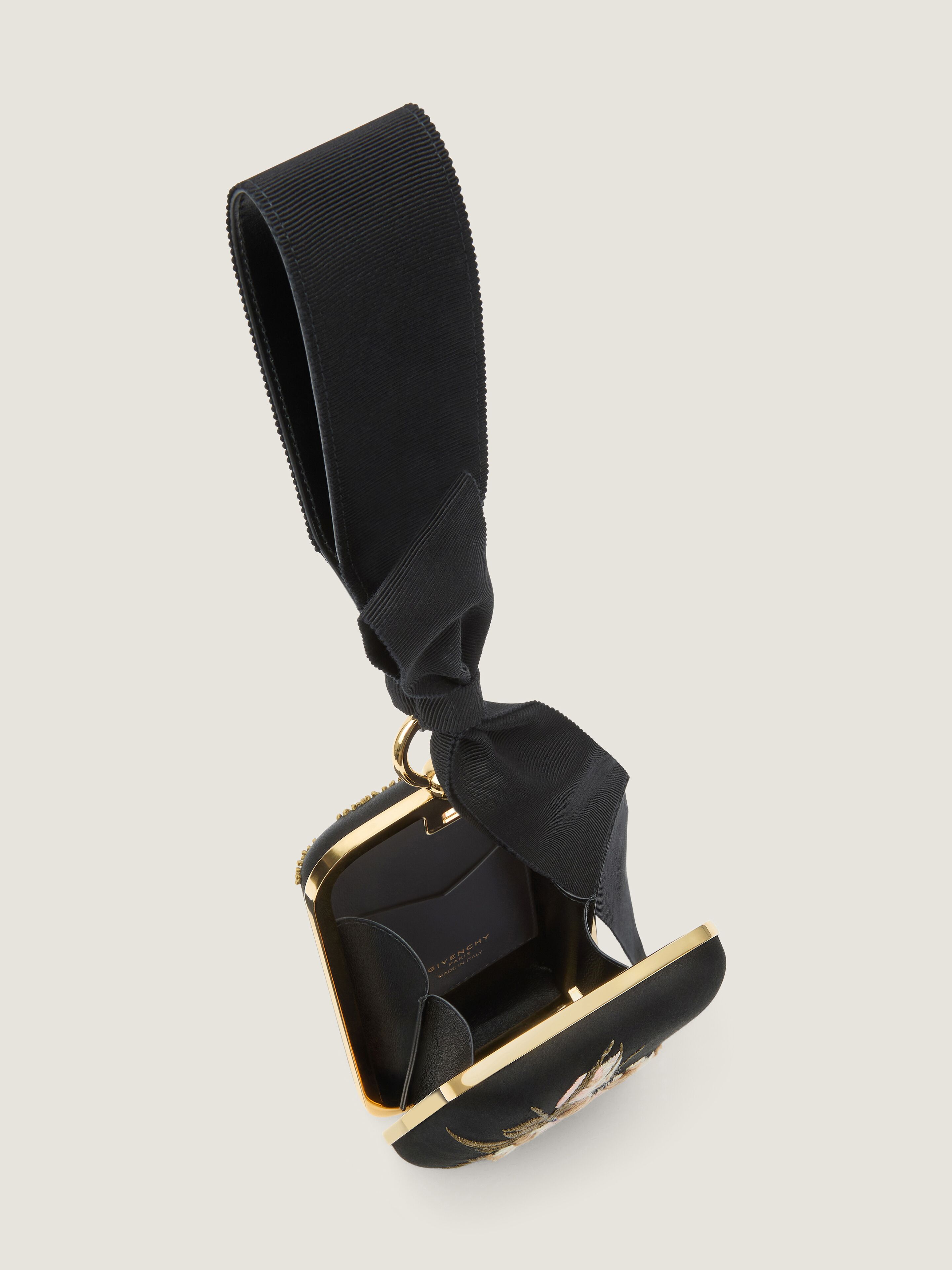 Evening clutch with floral embroideries and bow in - black