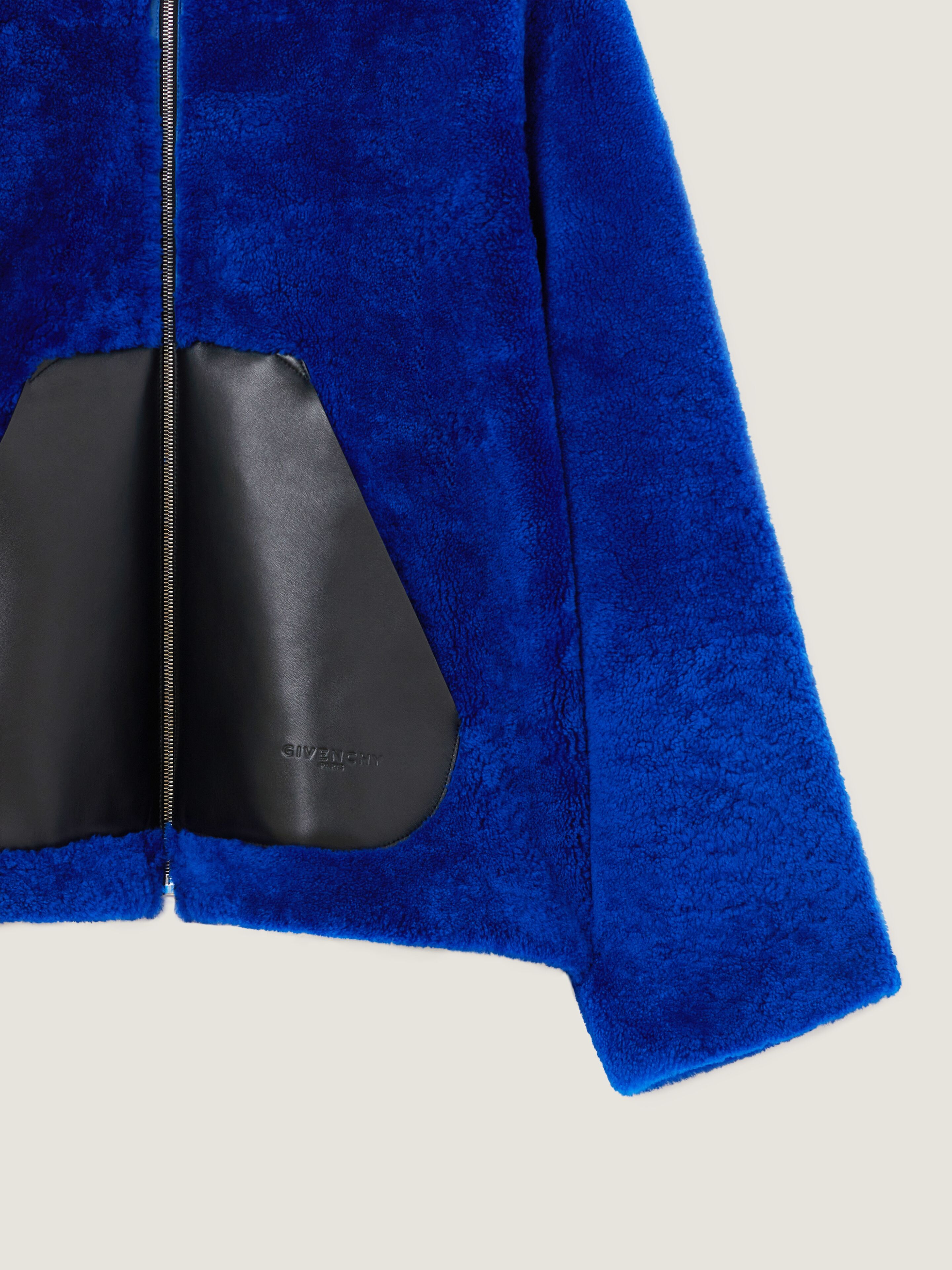 Zipped hoodie in shearling with leather pocket | Givenchy US