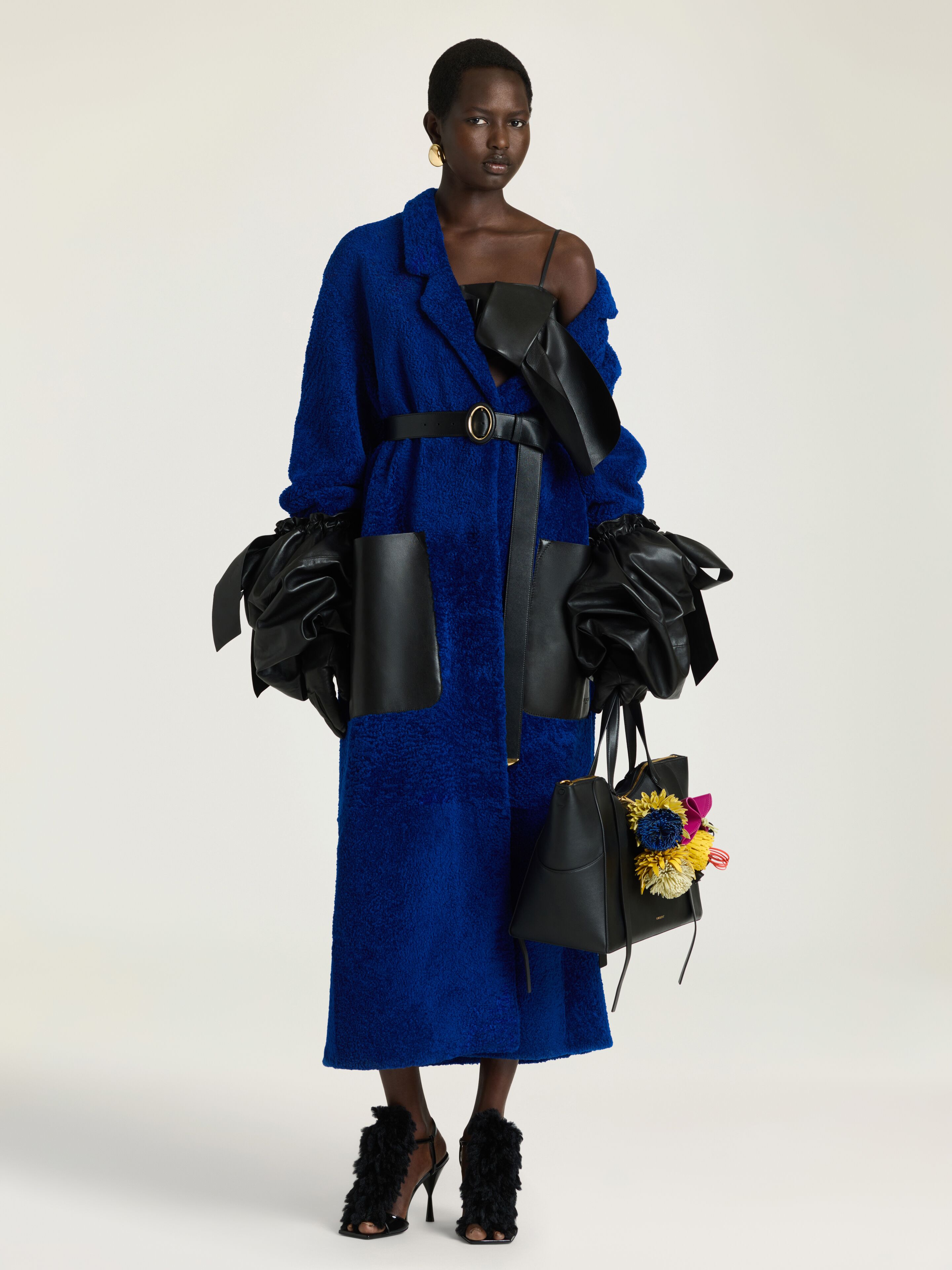 Long coat in shearling with leather pockets | Givenchy US | Givenchy