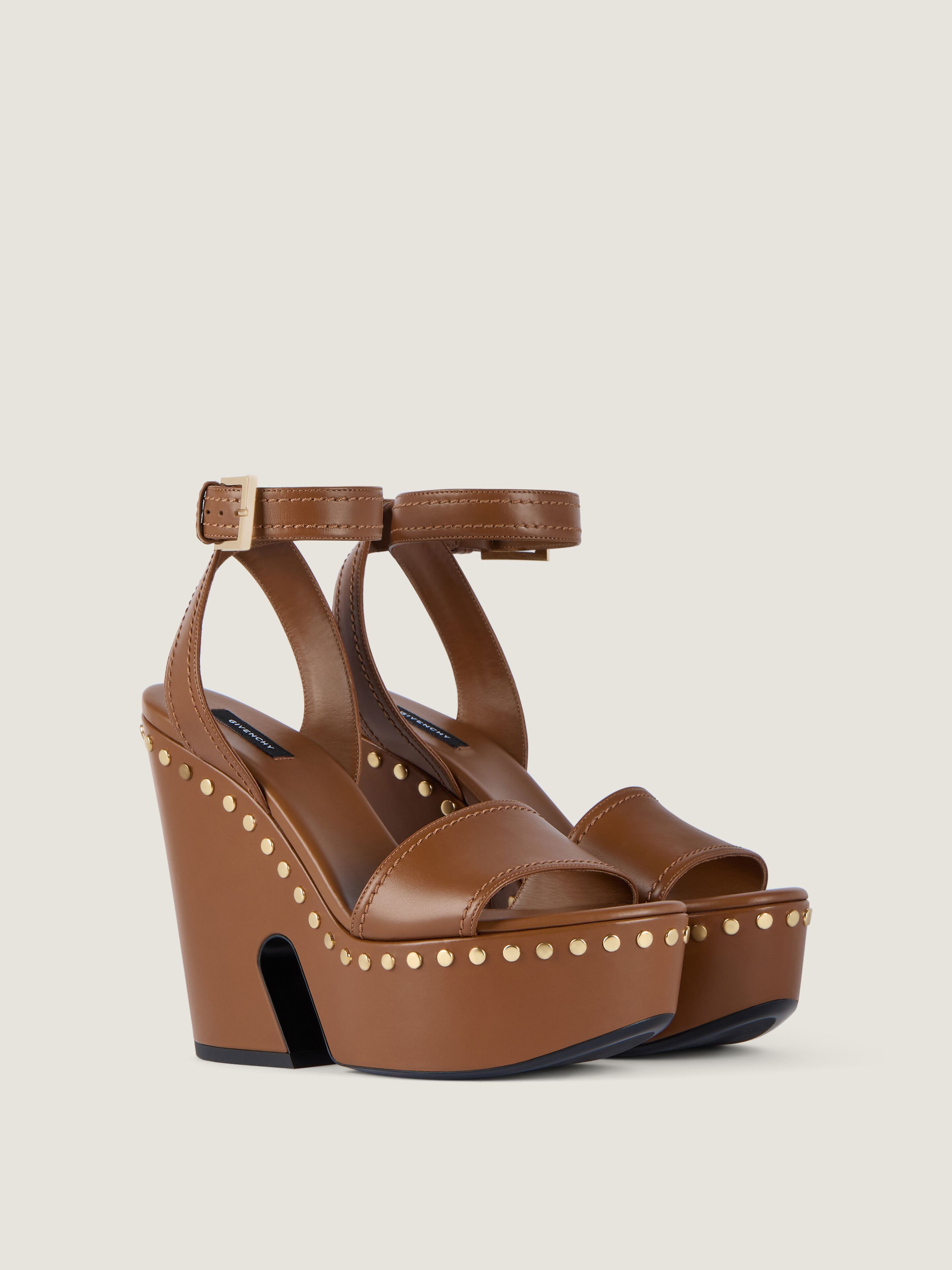 Clog platform sandals in leather with studs detail in - tan