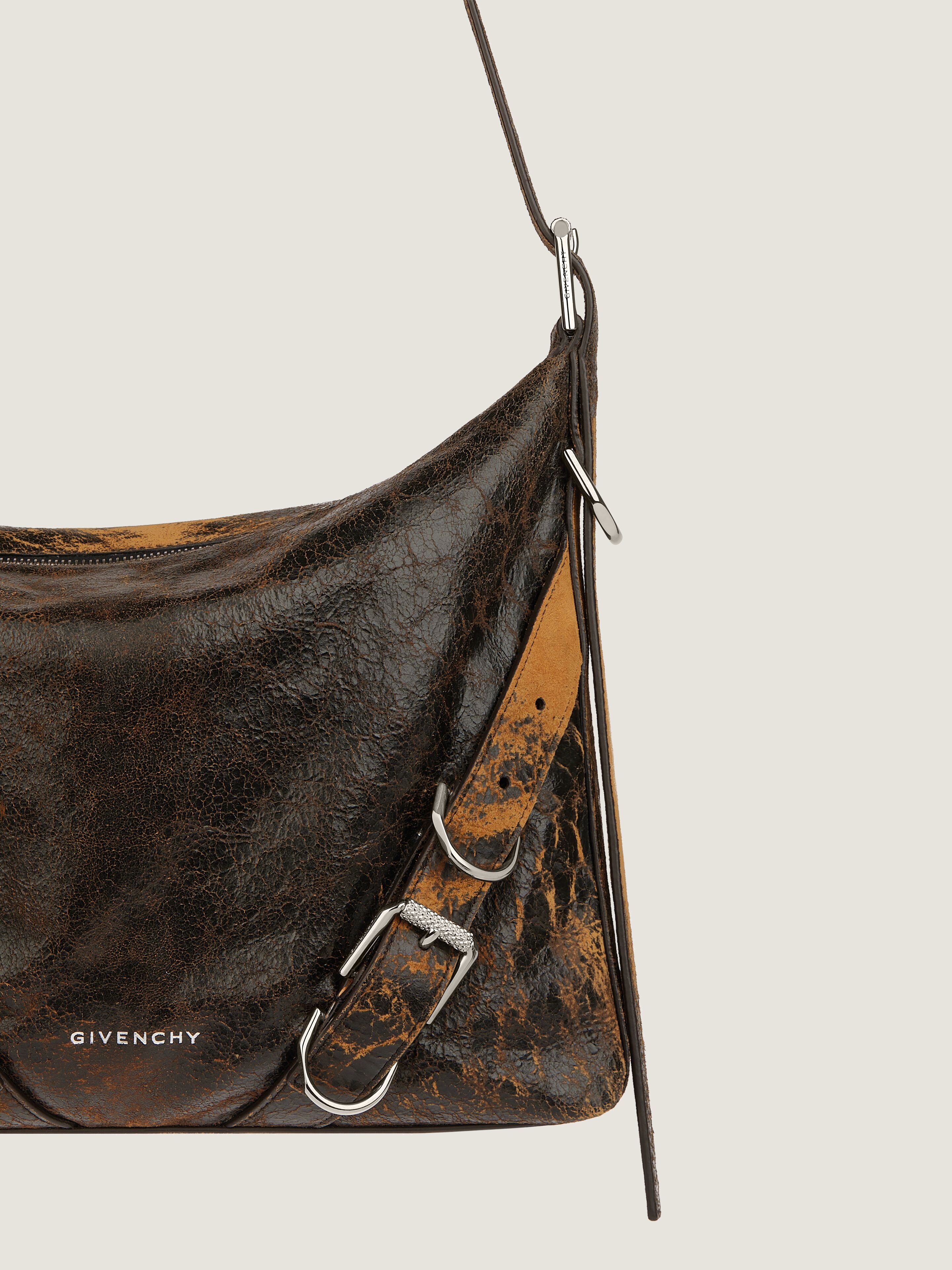 Voyou Crossbody bag in crackled leather in - black/brown mud