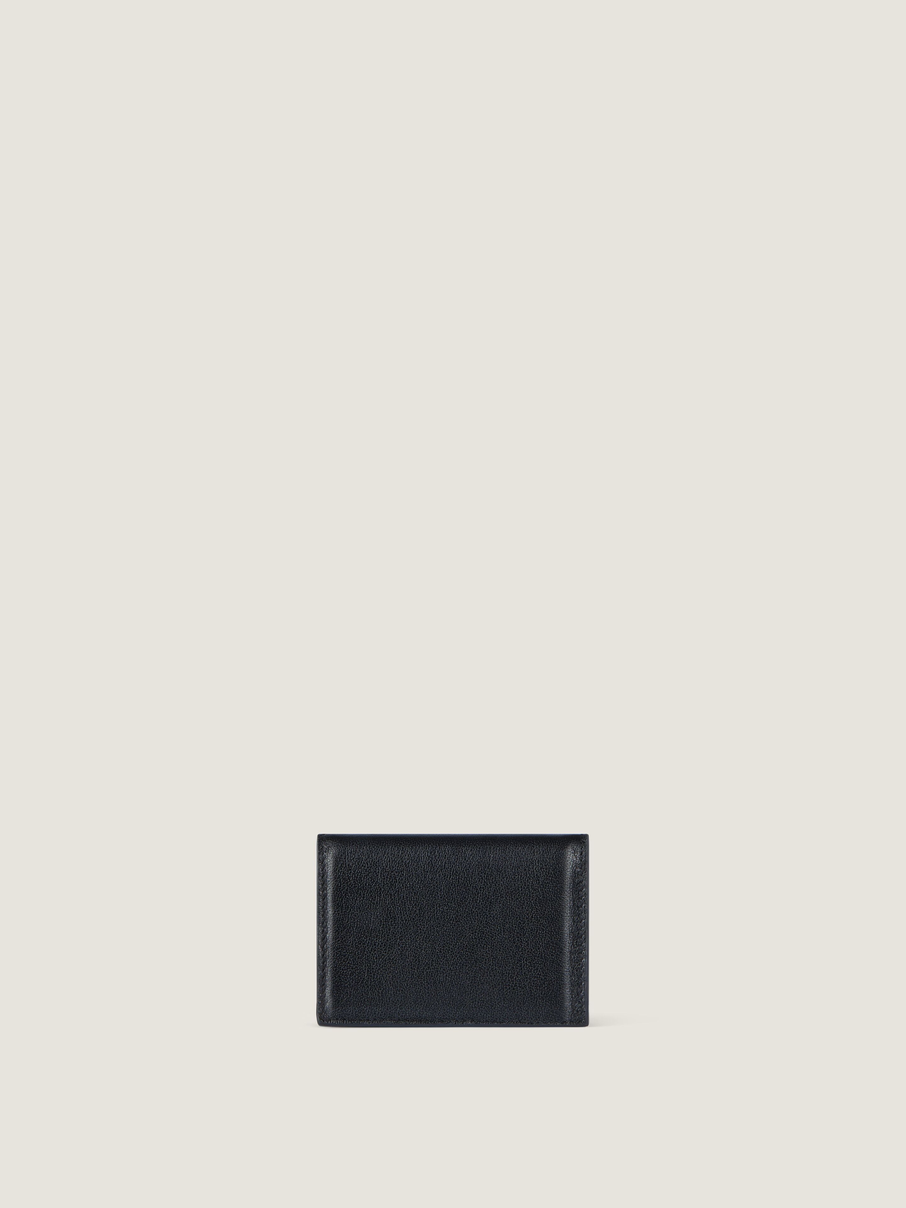 Antigona Stamped flap card holder in leather in - black