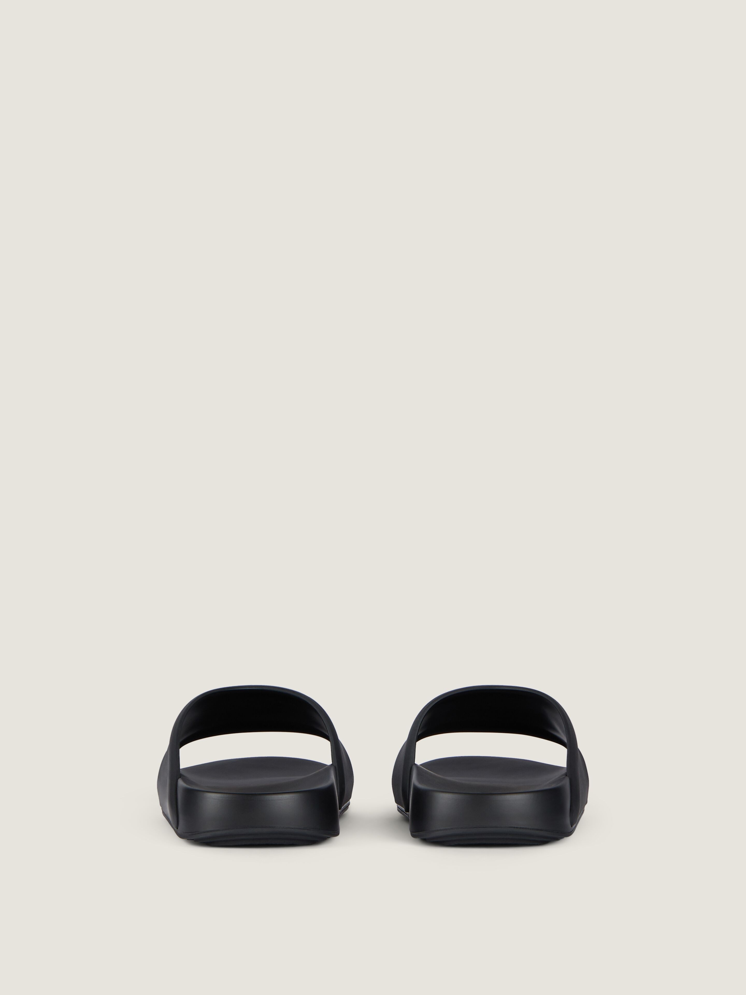 Label flat mules in rubber in - black | Givenchy US