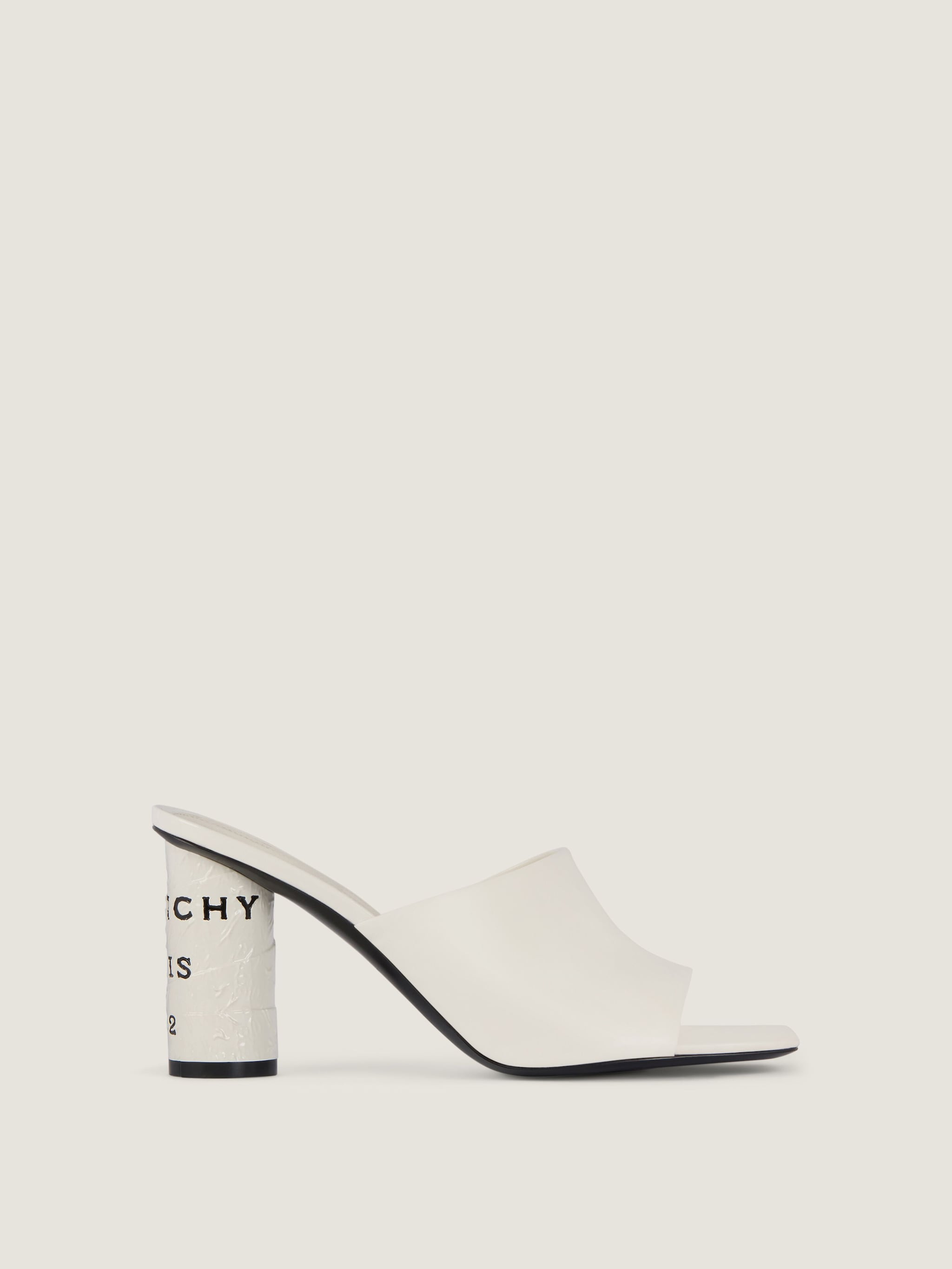 Tape heeled mules in leather