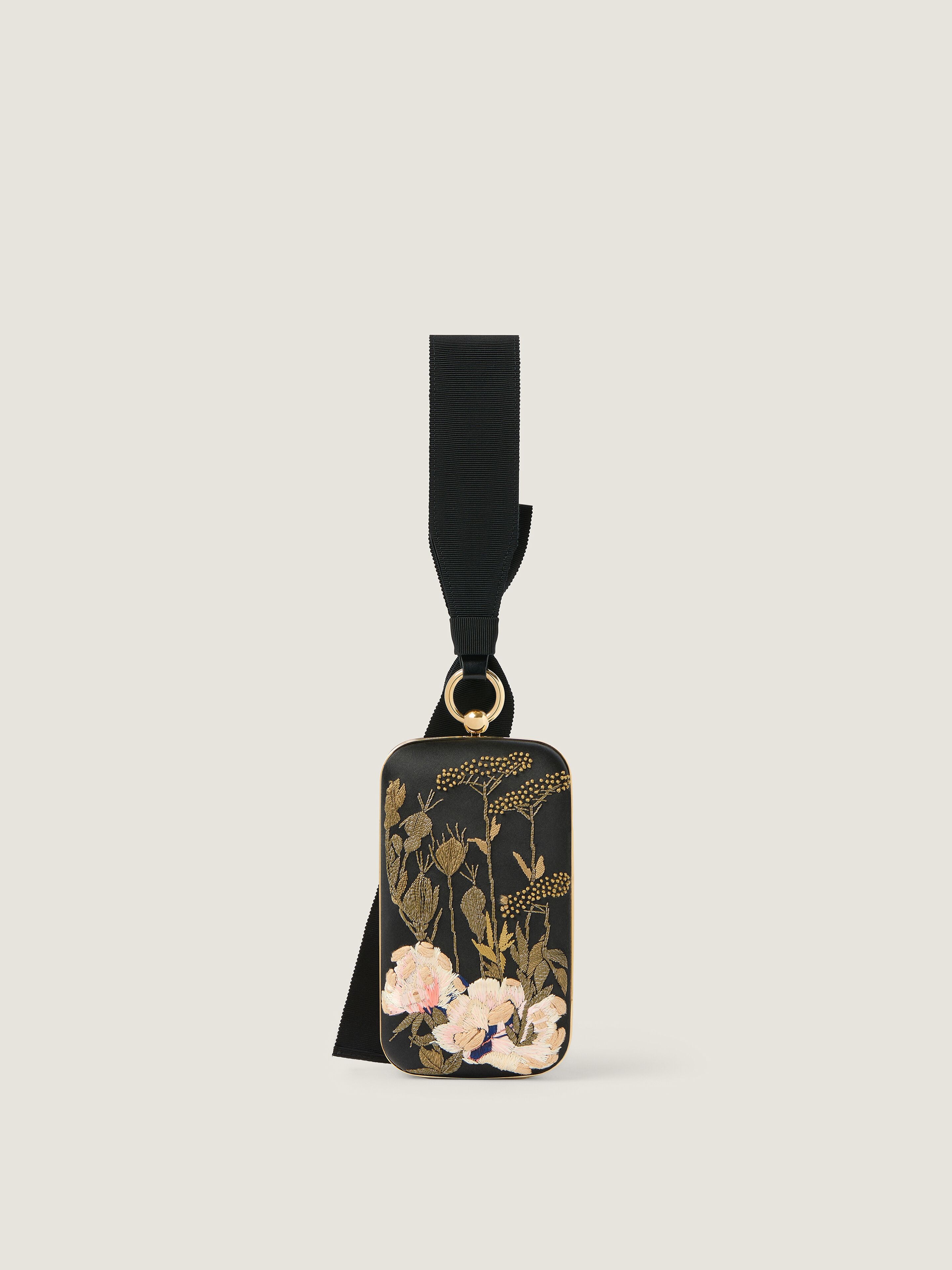 Evening clutch with floral embroideries and bow in - black