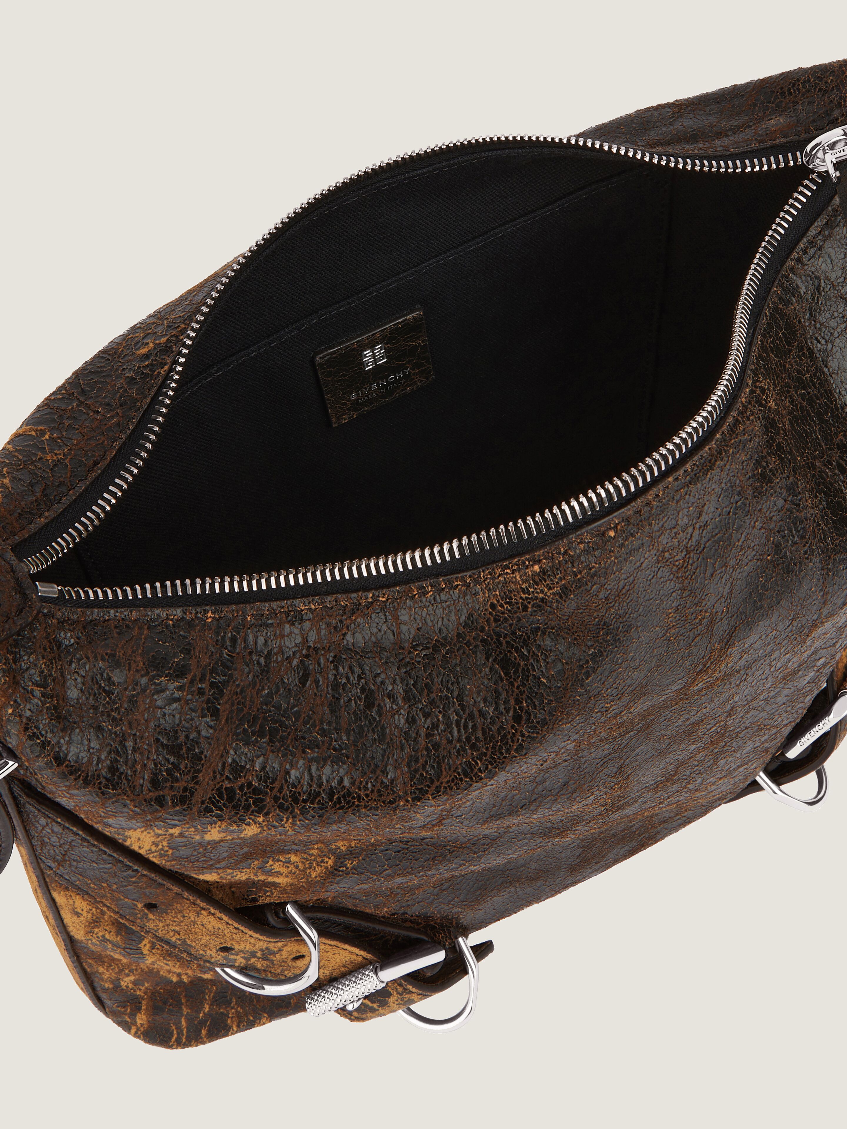 Voyou Crossbody bag in crackled leather in - black/brown mud