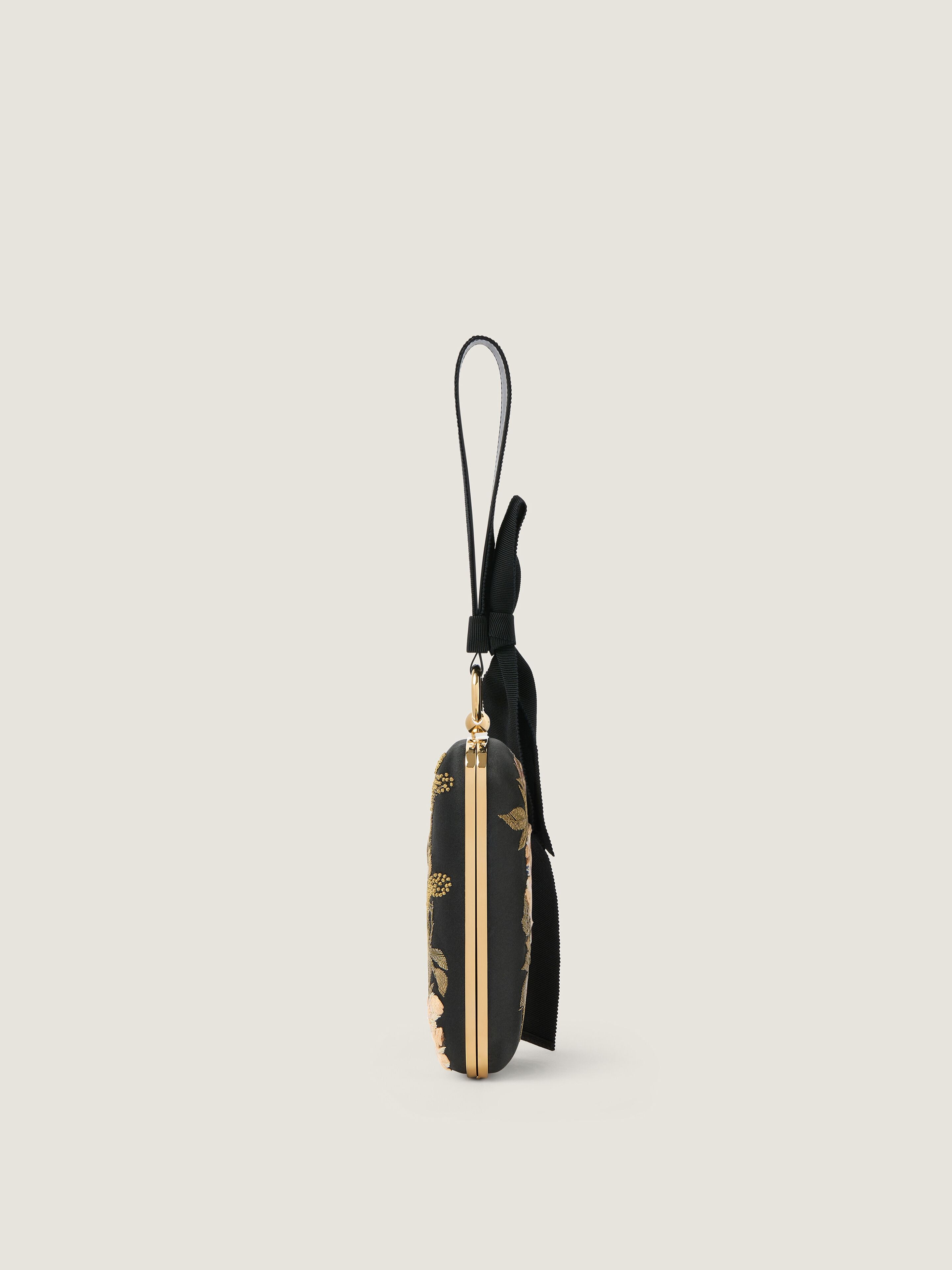 Evening clutch with floral embroideries and bow in - black