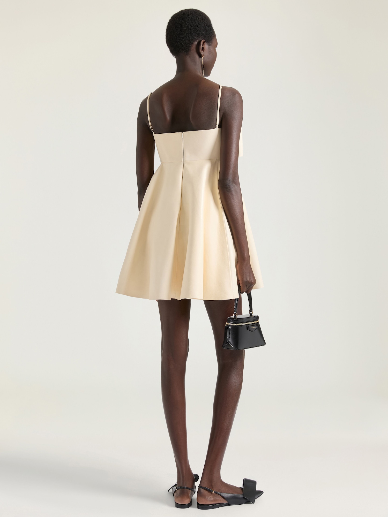 beige dress with black heels Kendall, Hailey, and Laura Can't Stop Wearing Jersey Dresses