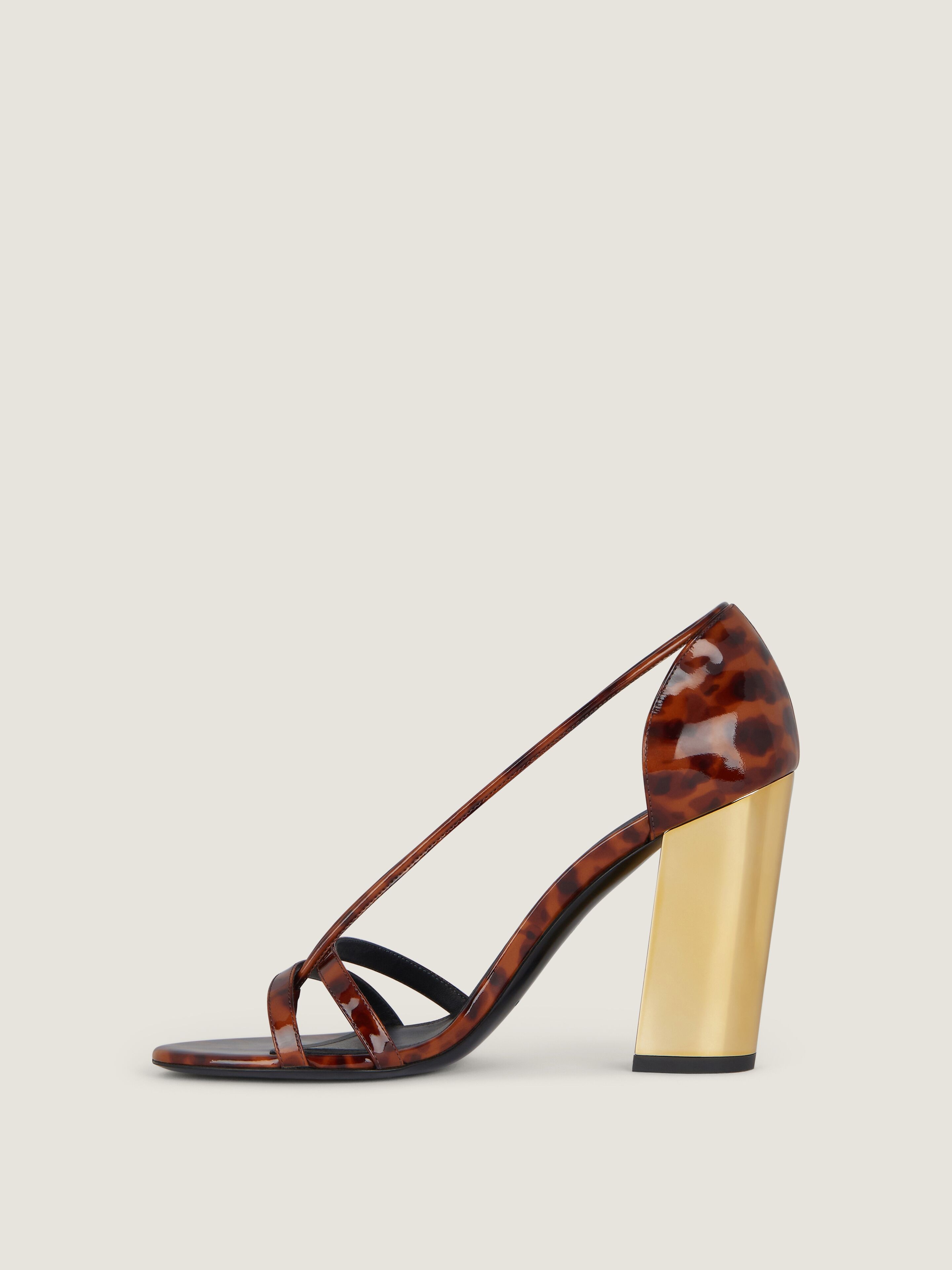 Block heeled sandals in tortoise shell patent leather in