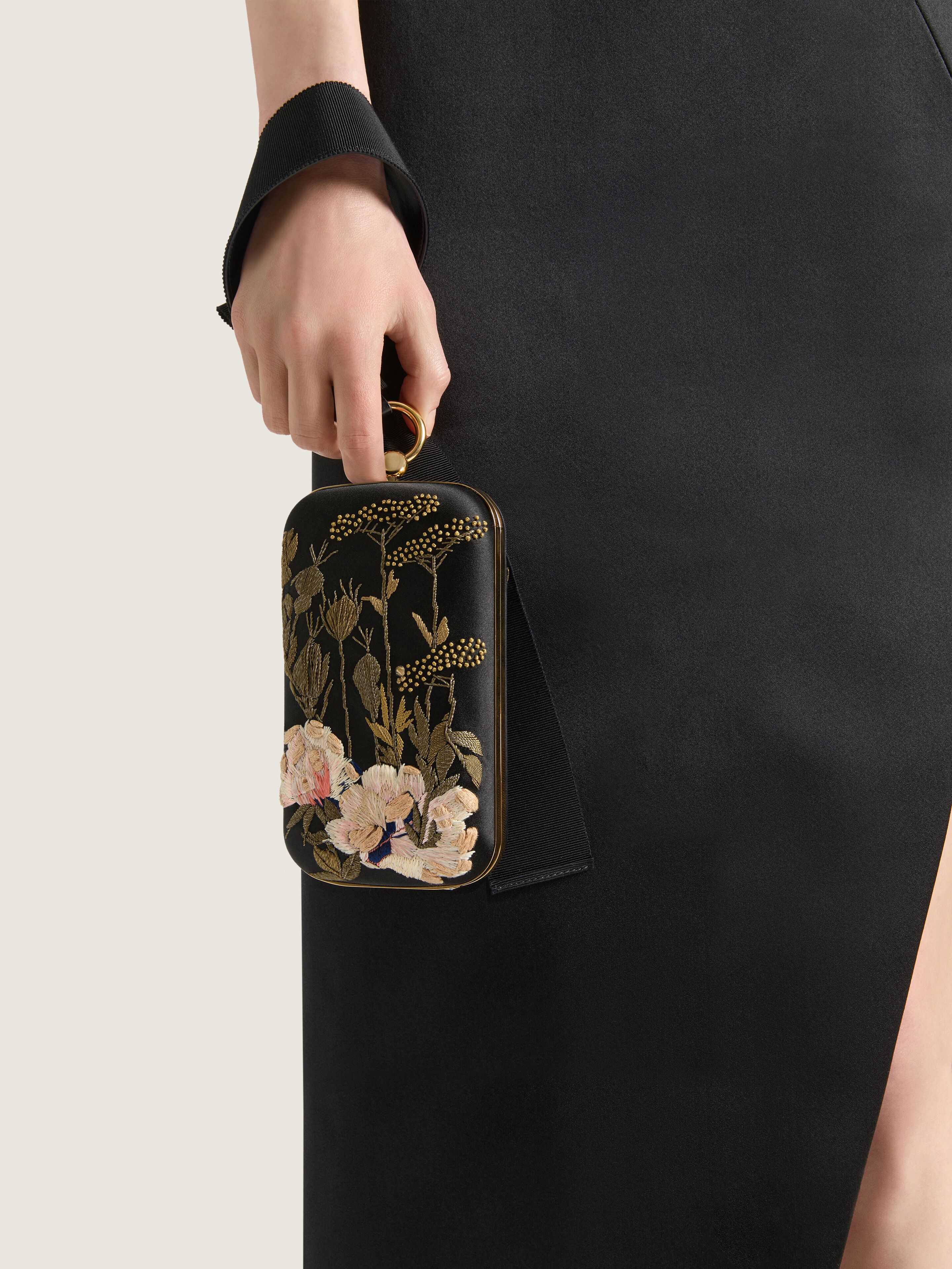 Evening clutch with floral embroideries and bow in - black