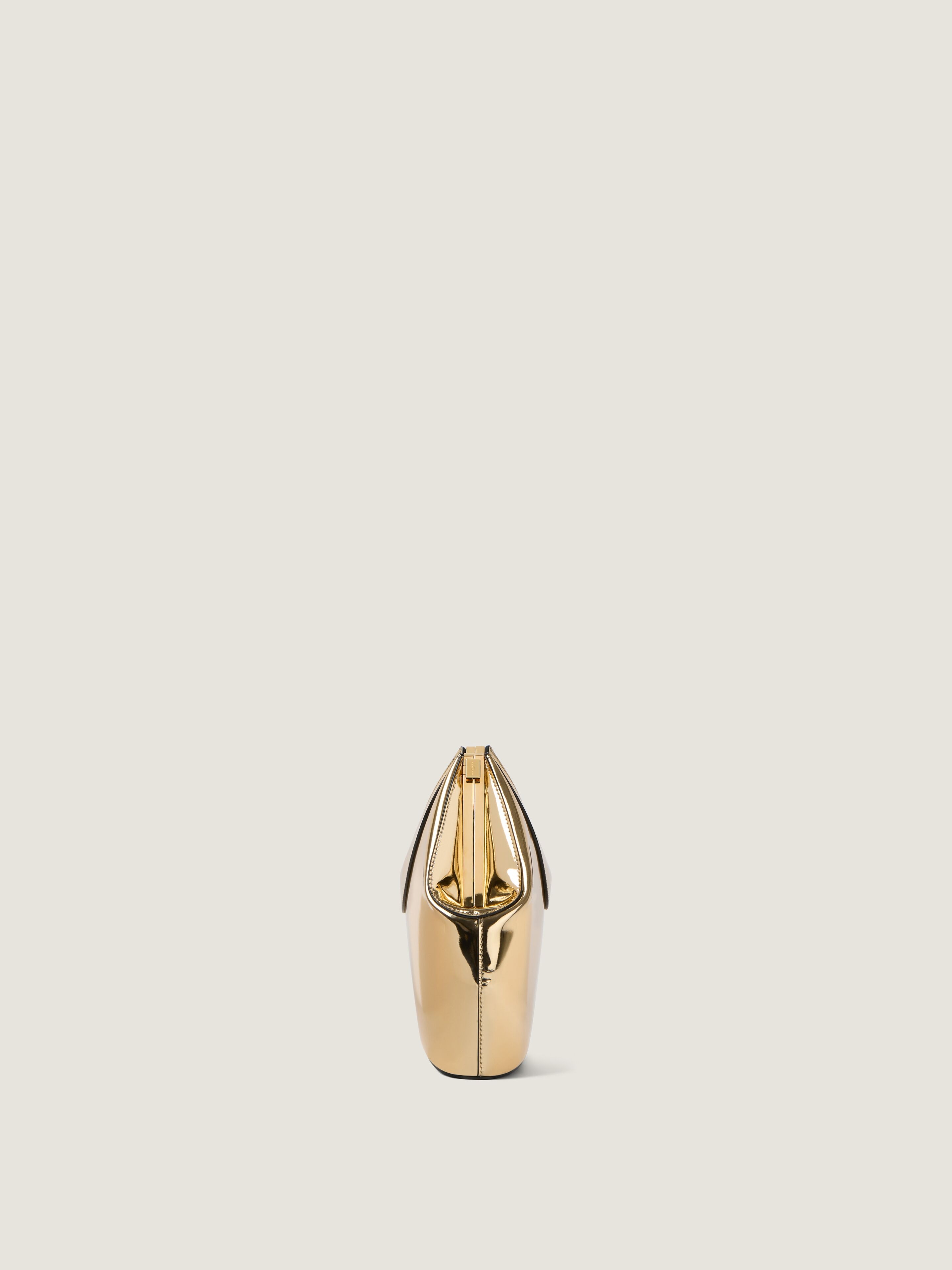 Facet clutch in mirror effect leather - golden in - golden
