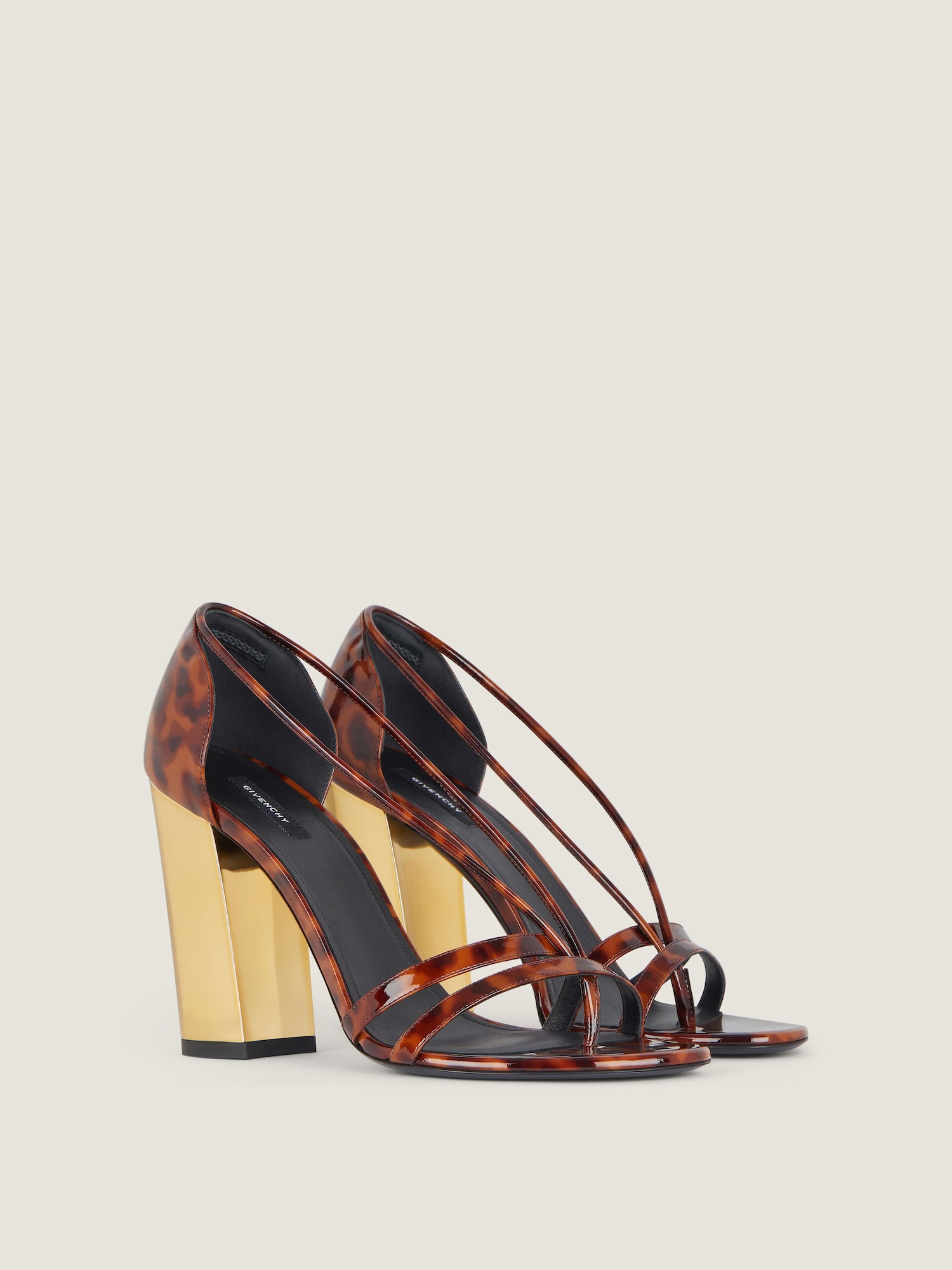 Block heeled sandals in tortoise shell patent leather in dark