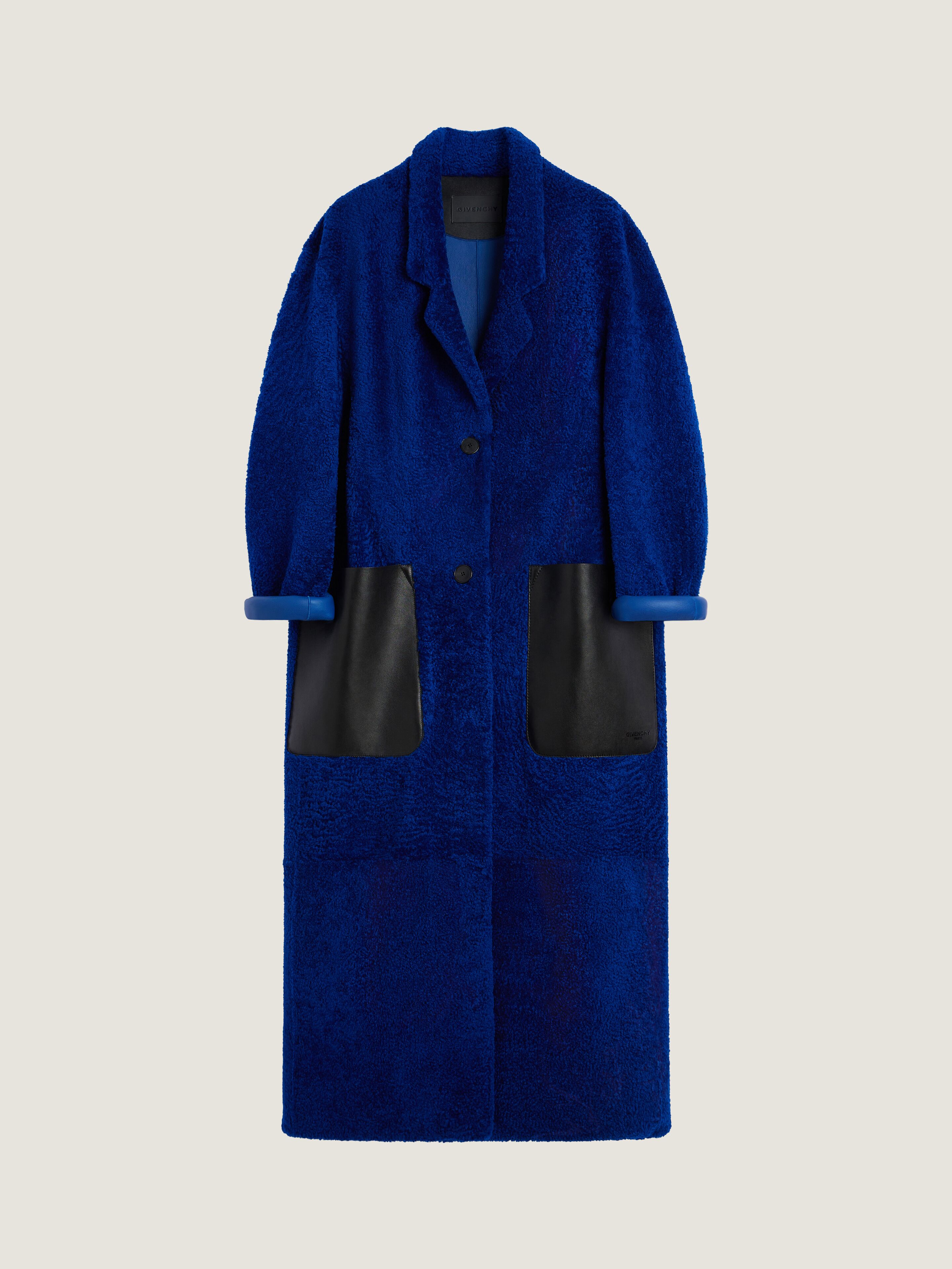 Long coat in shearling with leather pockets | Givenchy US | Givenchy