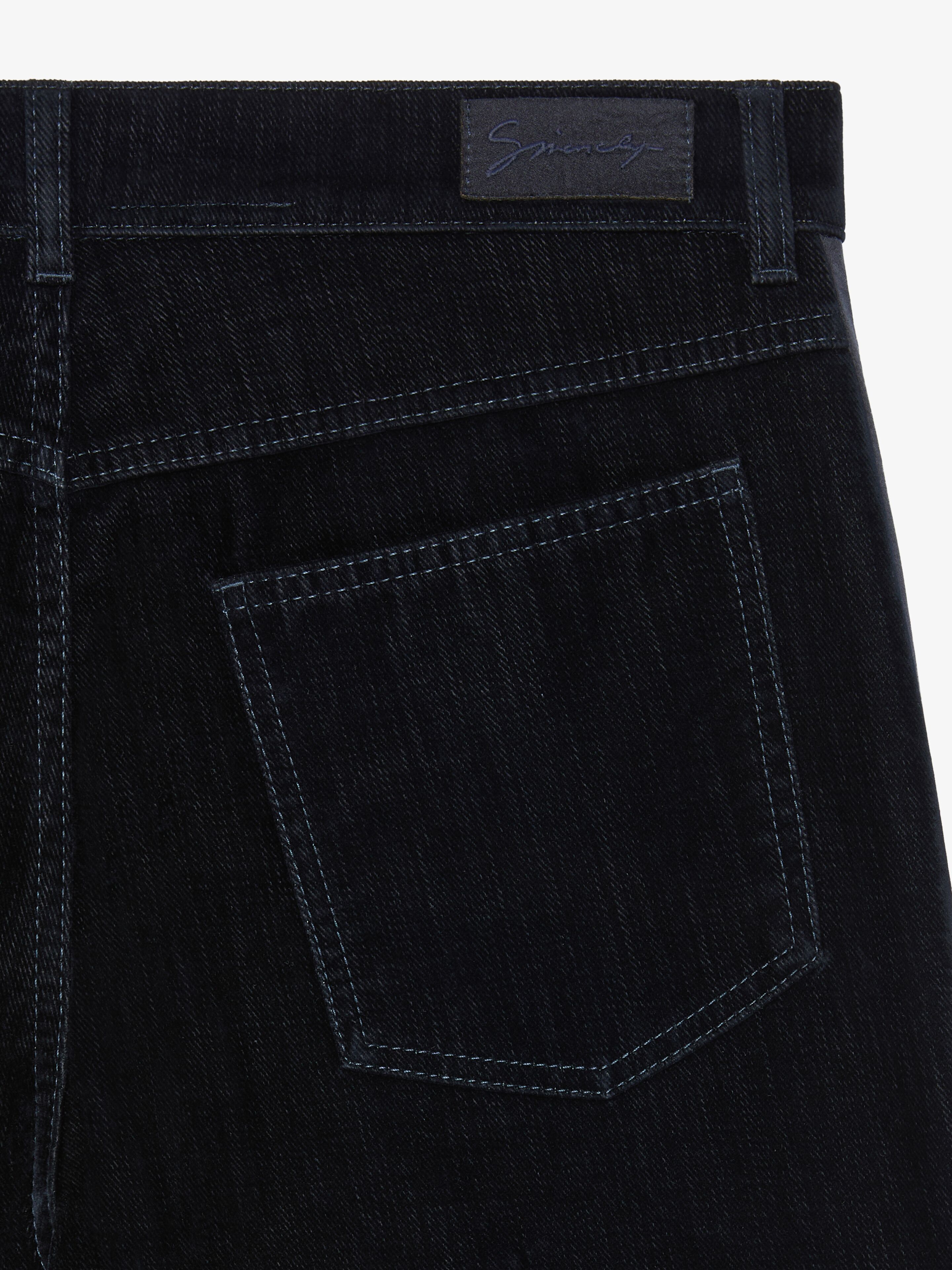 Slim fit jeans in velvet flocked denim with satin bands in