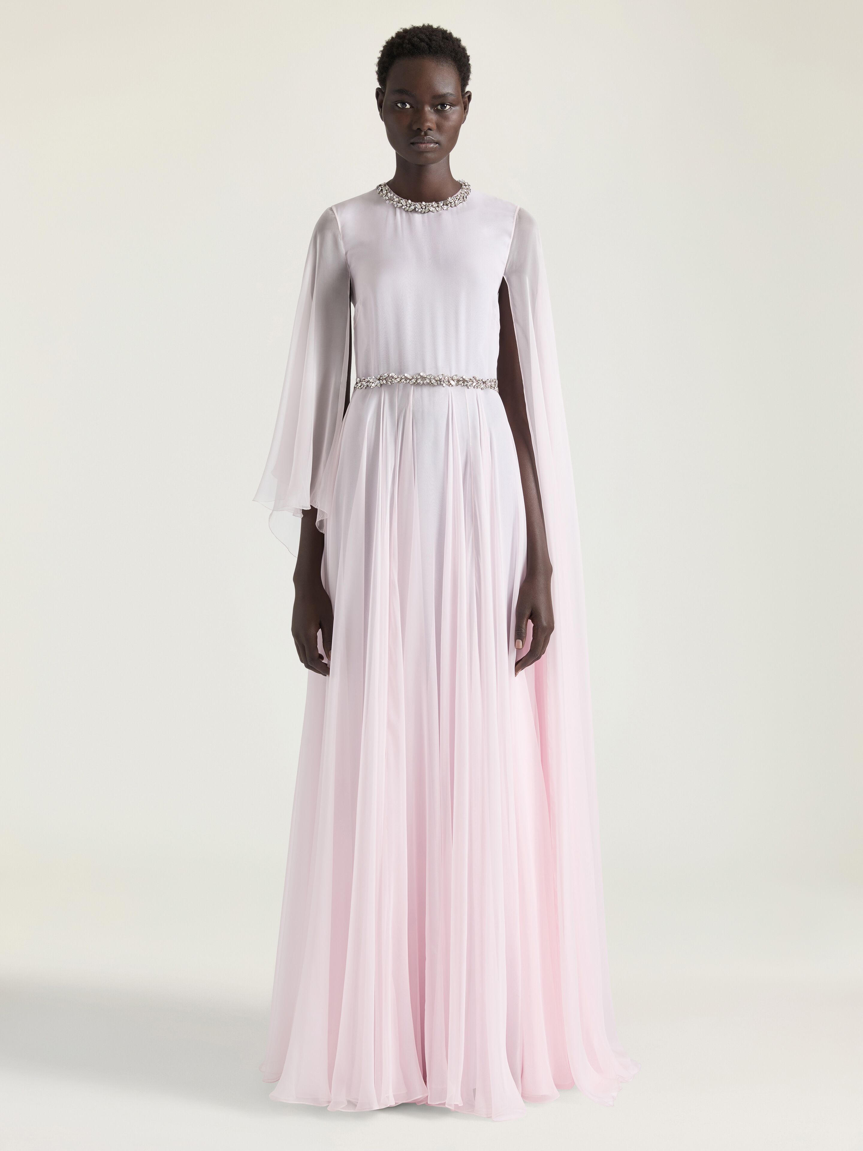 Draped evening dress in chiffon with crystals and cape