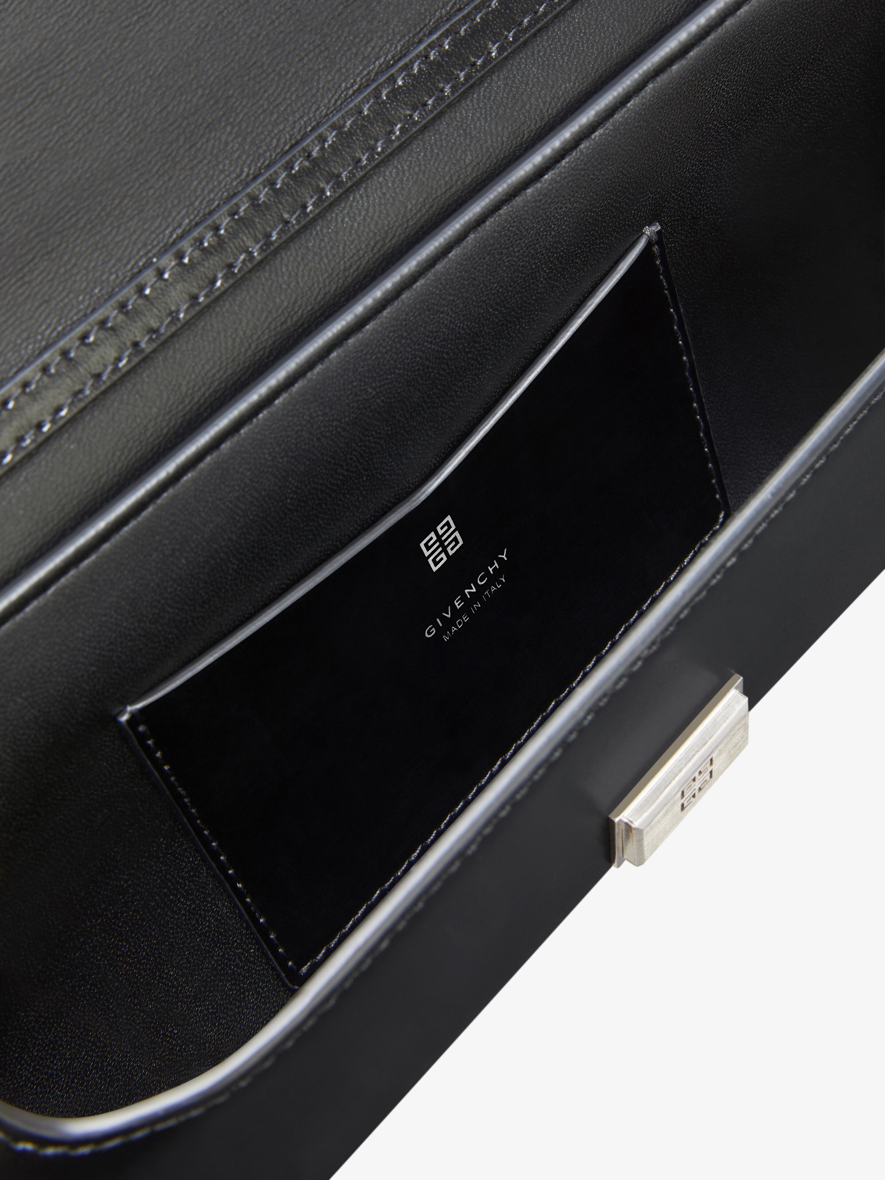 Voyou Clutch bag in crocodile effect leather in - black
