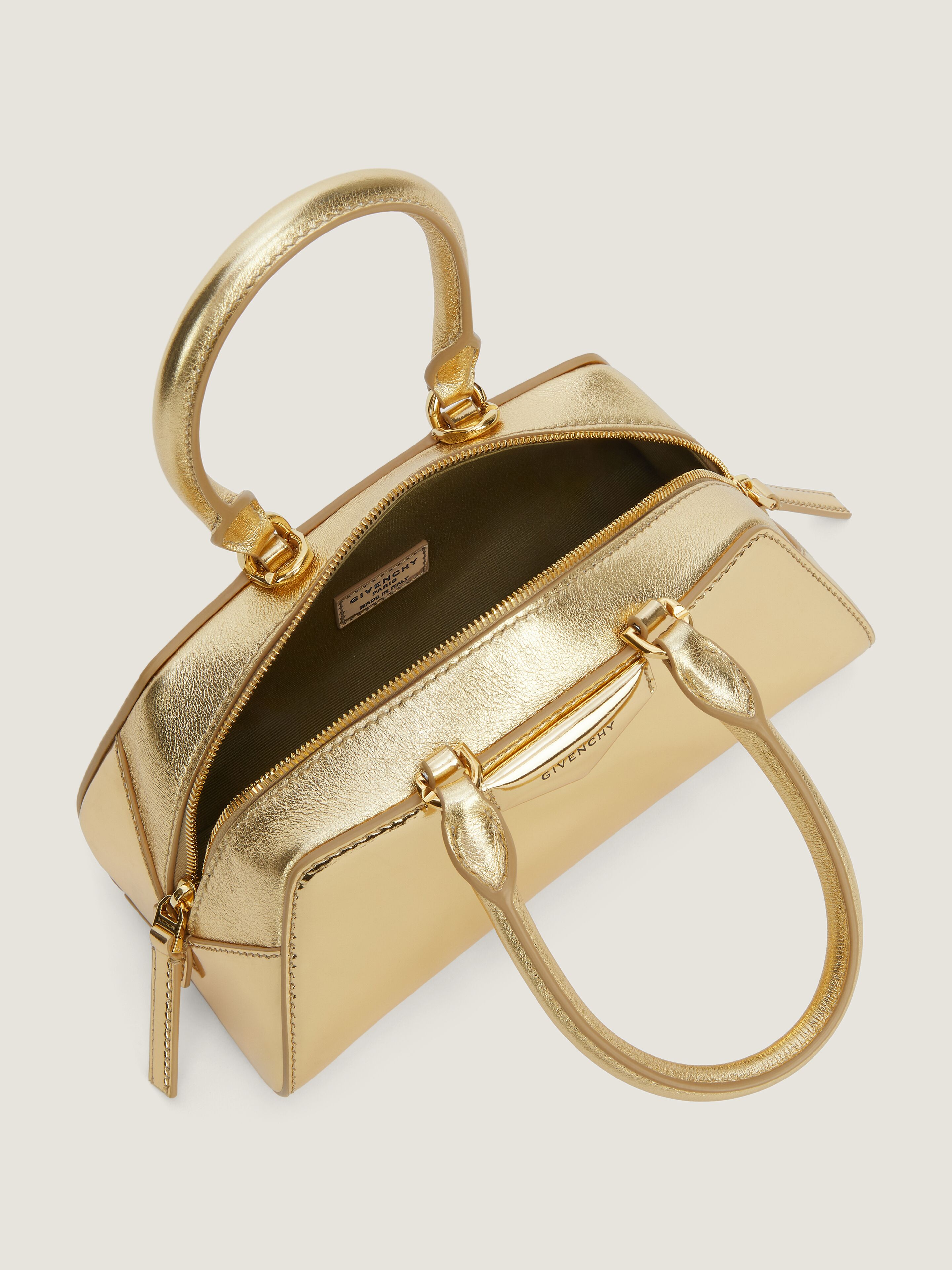 Mini Antigona East-West bag in laminated leather in - golden