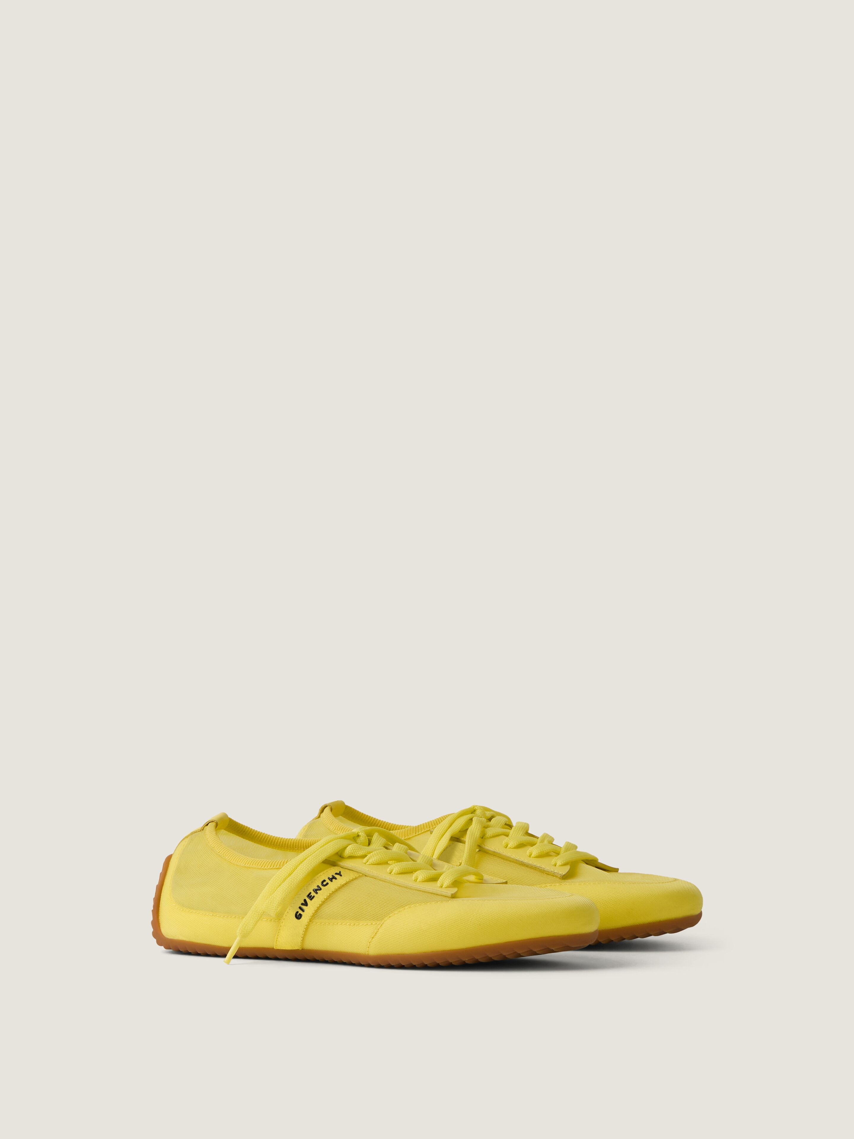 Slim sneakers in transparent mesh and leather in - acid yellow