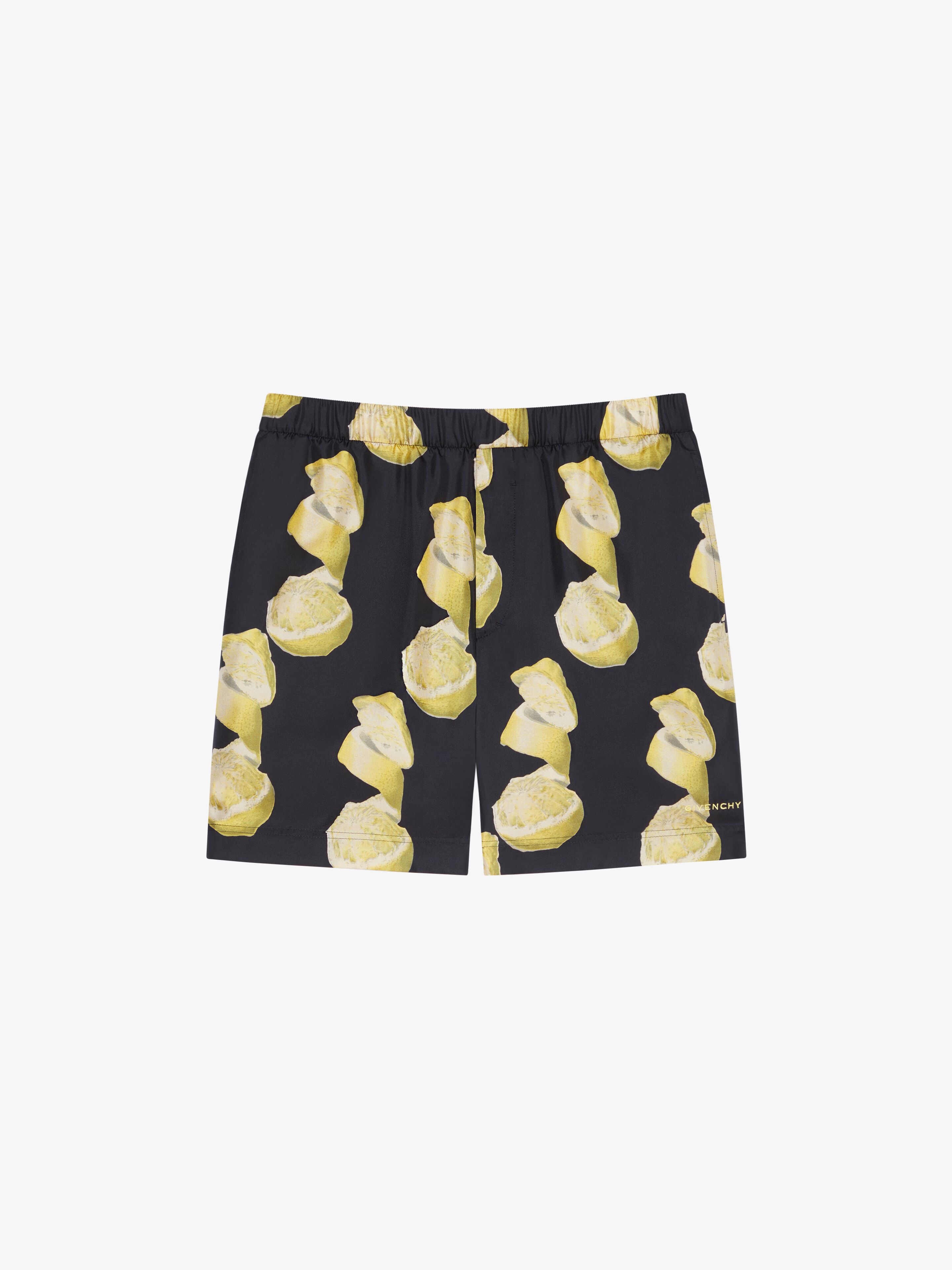 Shop Givenchy Long Printed Swim Shorts In Black/yellow